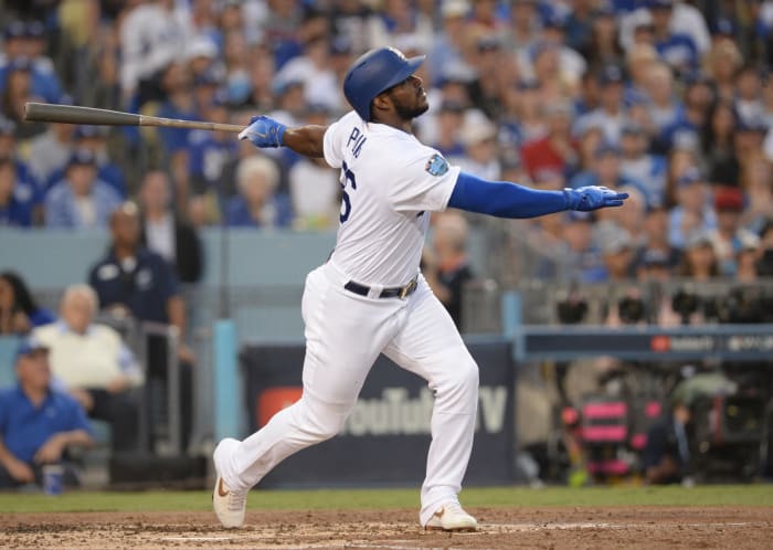 Oct 28, 2018; Los Angeles, CA, USA; Los Angeles Dodgers outfielder Yasiel Puig (66) hits a single in the second inning against the Boston Red Sox in game five of the 2018 World Series at Dodger Stadium.